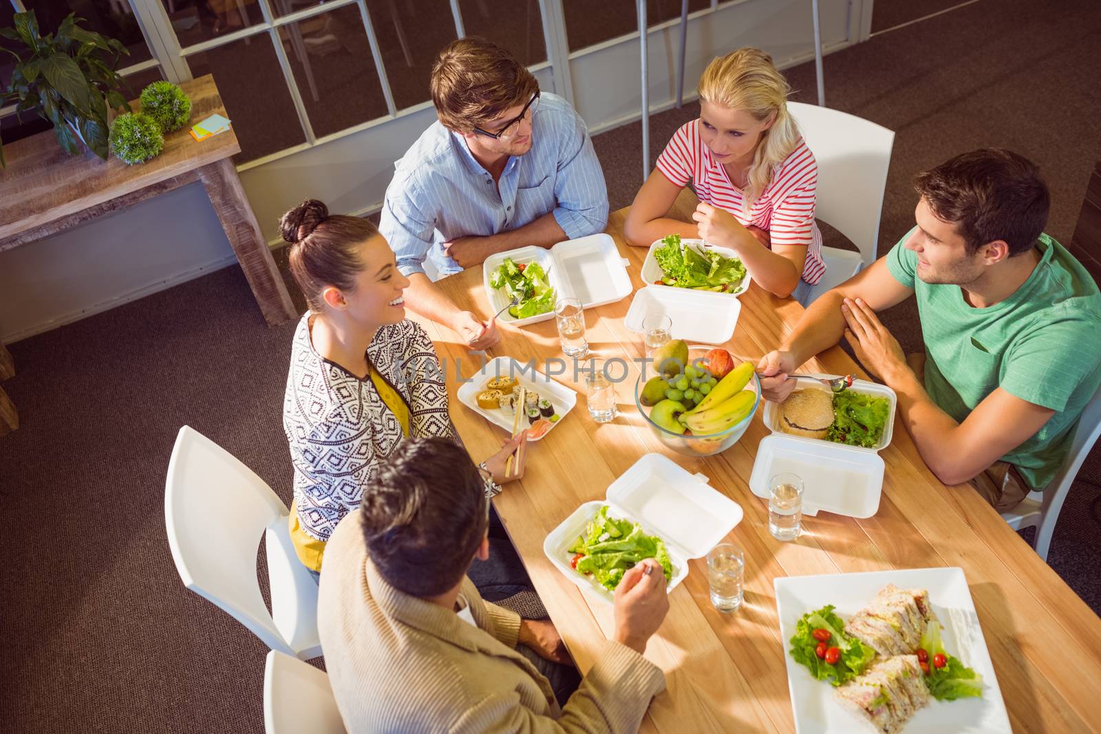 Young business people having lunch together