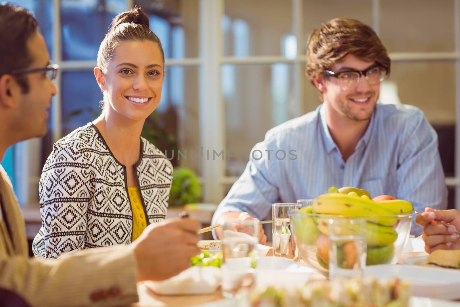 Young business people having lunch together