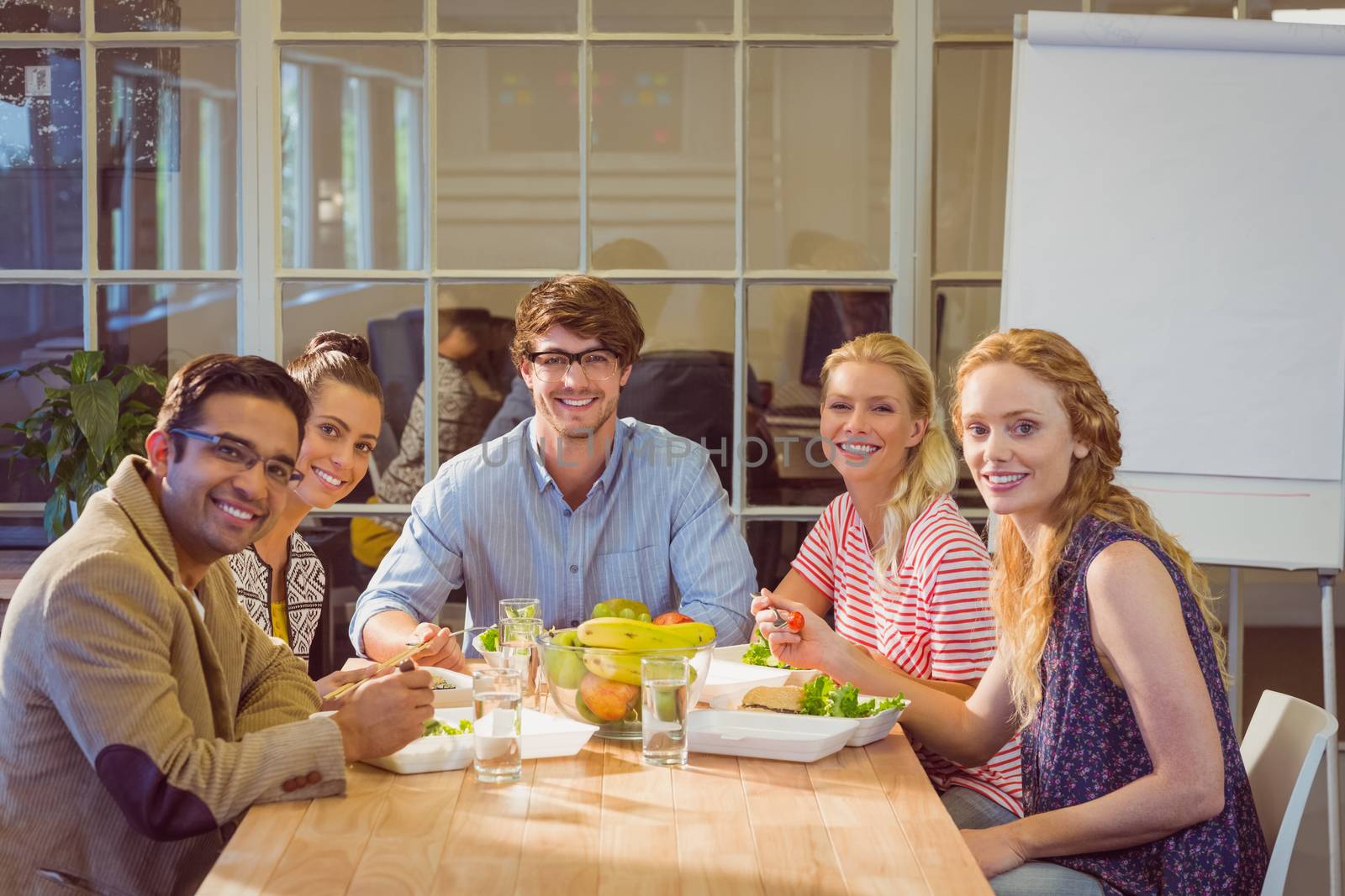 Young business people having lunch together