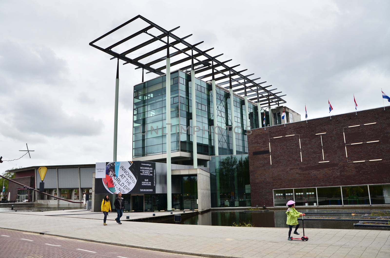 Rotterdam, Netherlands - May 9, 2015: People visit Het Nieuwe Institut museum on May 9, 2015 in Rotterdam, Netherlands. This museum is a cultural institute for architecture and urban development.