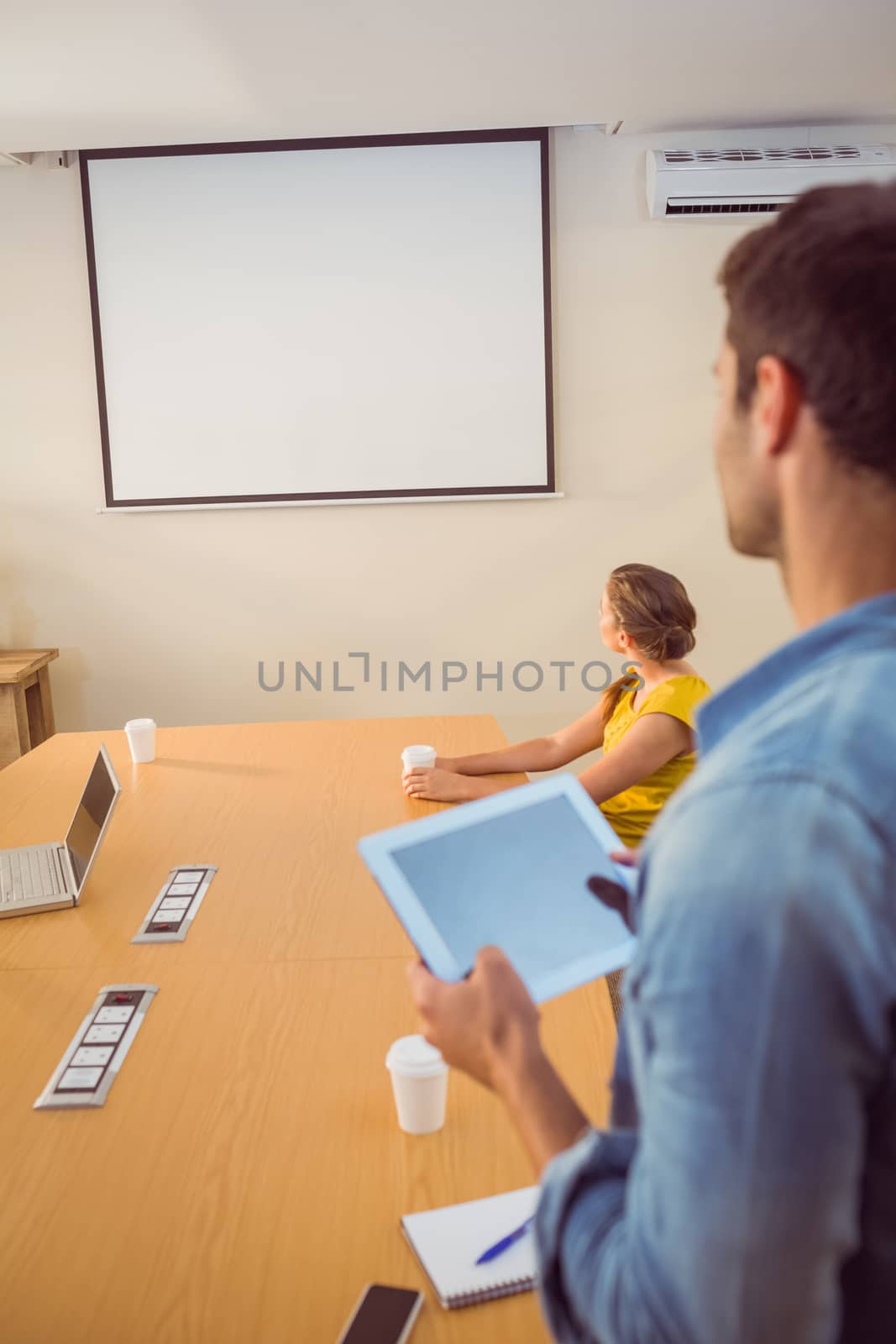 Attentive business team following a presentation in the office