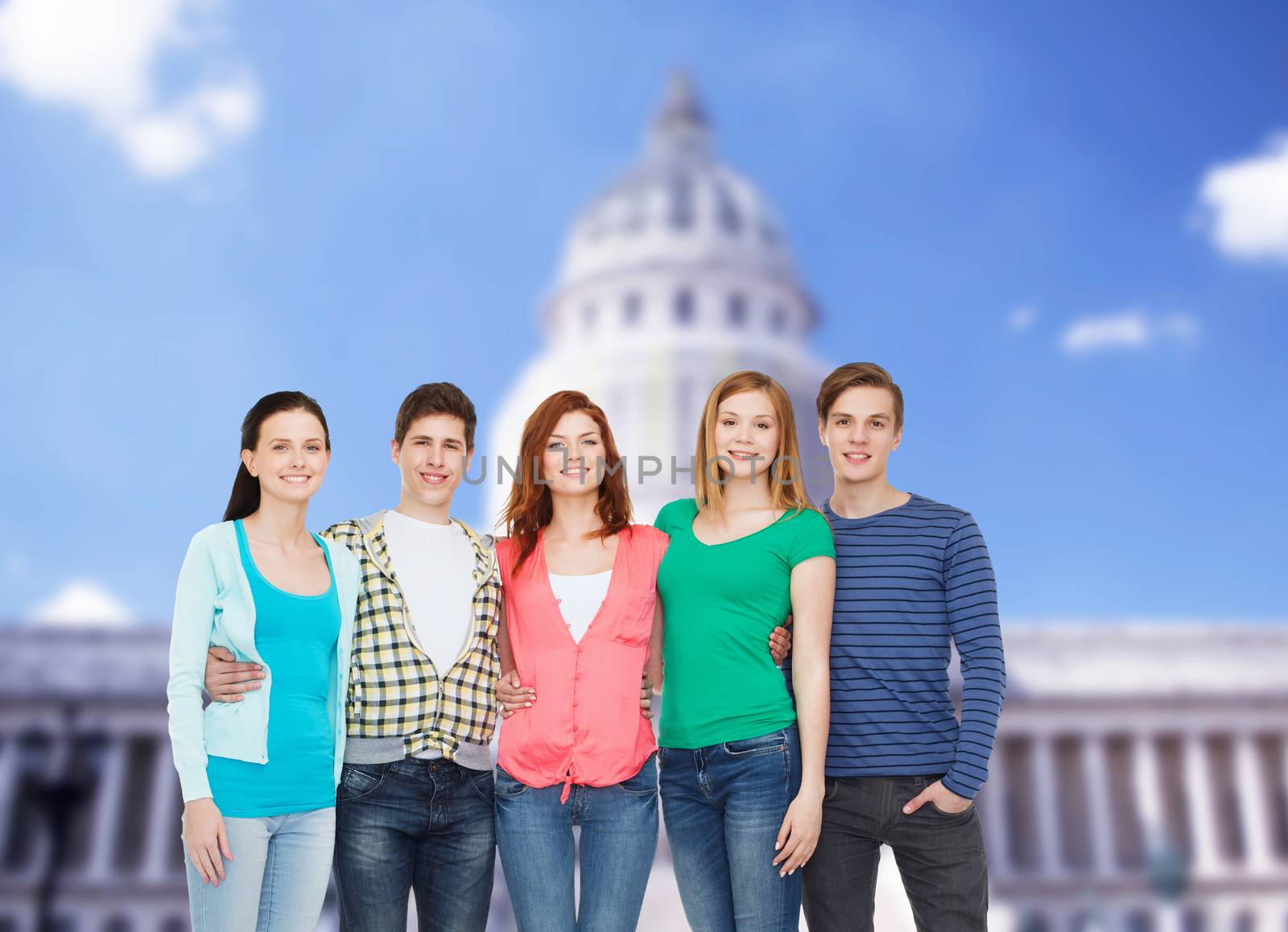 education and people concept - group of smiling students standing