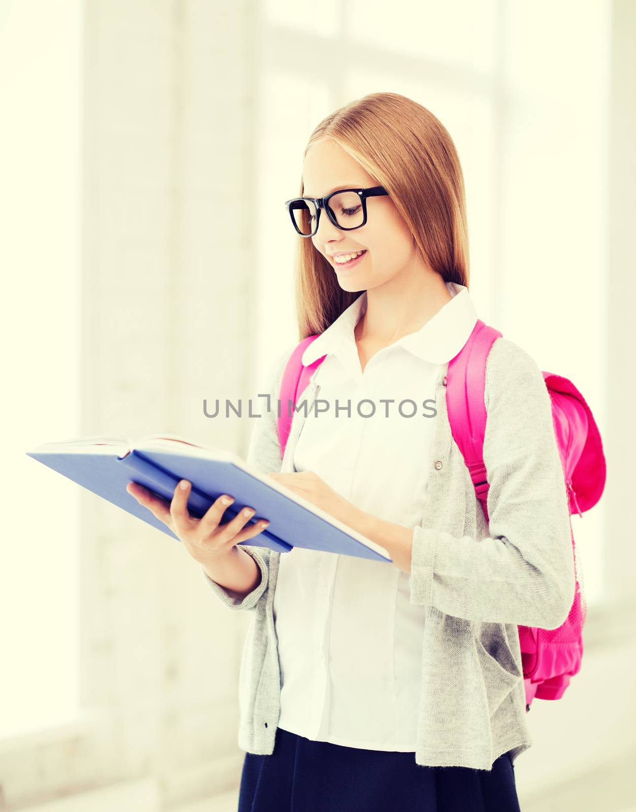 girl reading book at school by dolgachov