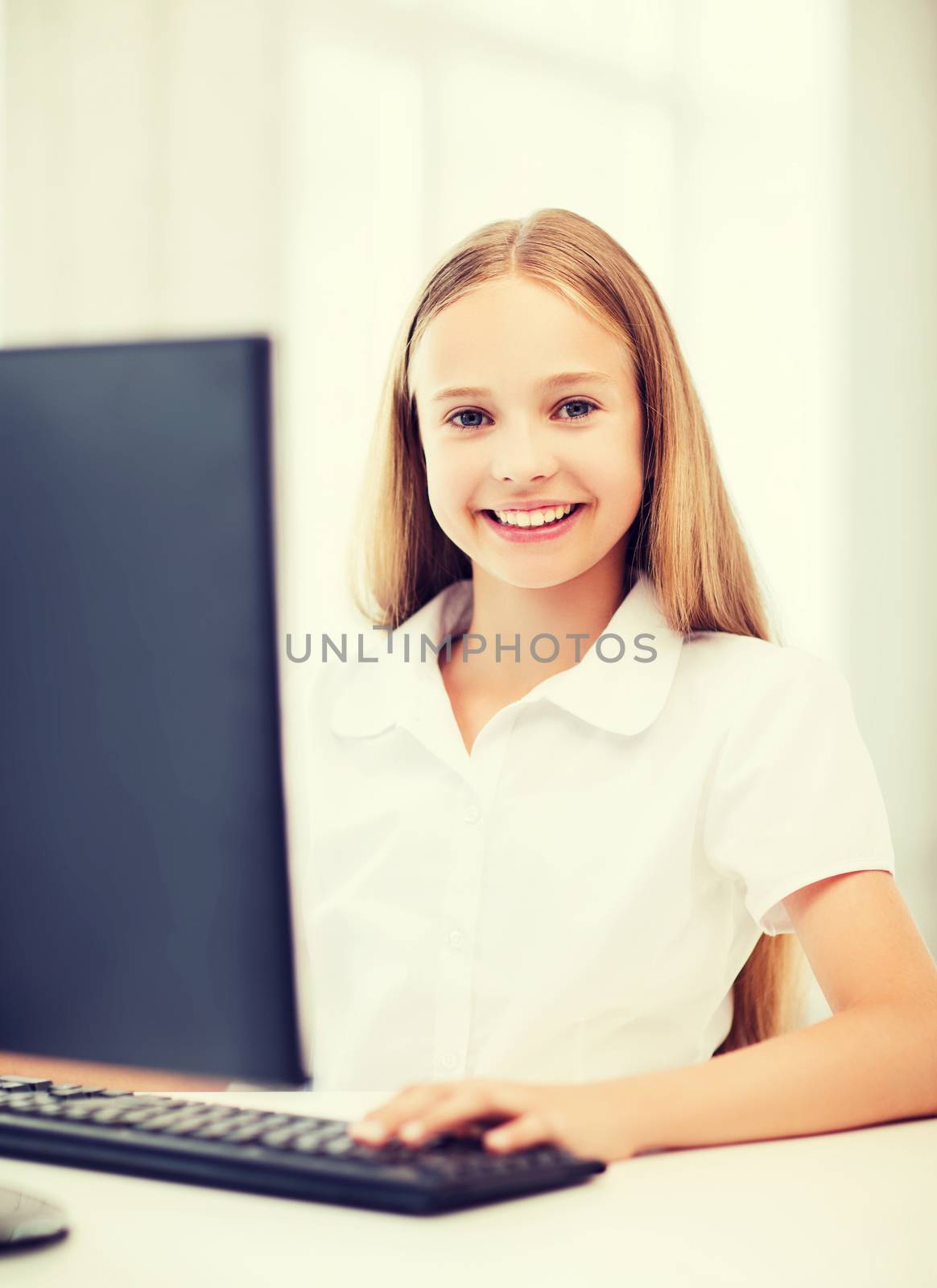 student girl with computer at school by dolgachov