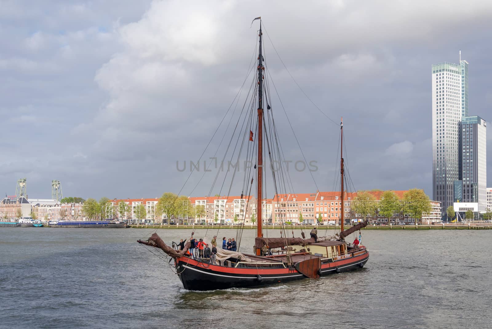 Rotterdam, Netherlands - May 9, 2015: Tourist boat on Nieuwe Maas (New Meuse) river in Rotterdam by siraanamwong