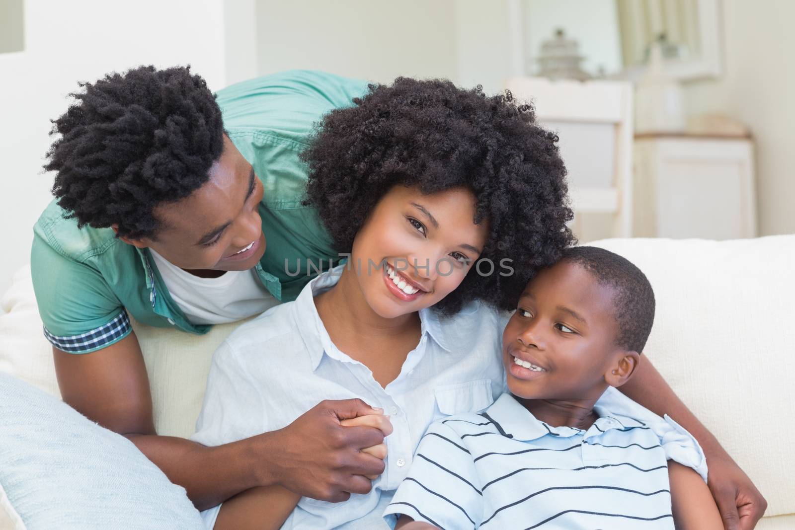 Happy family on the couch at home in the living room