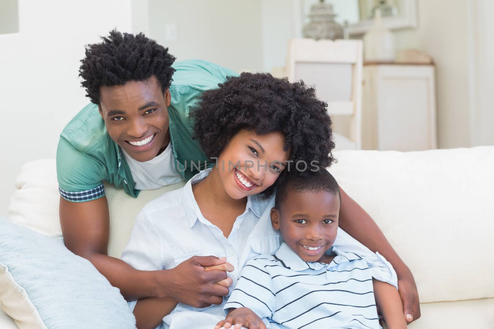 Happy family on the couch at home in the living room