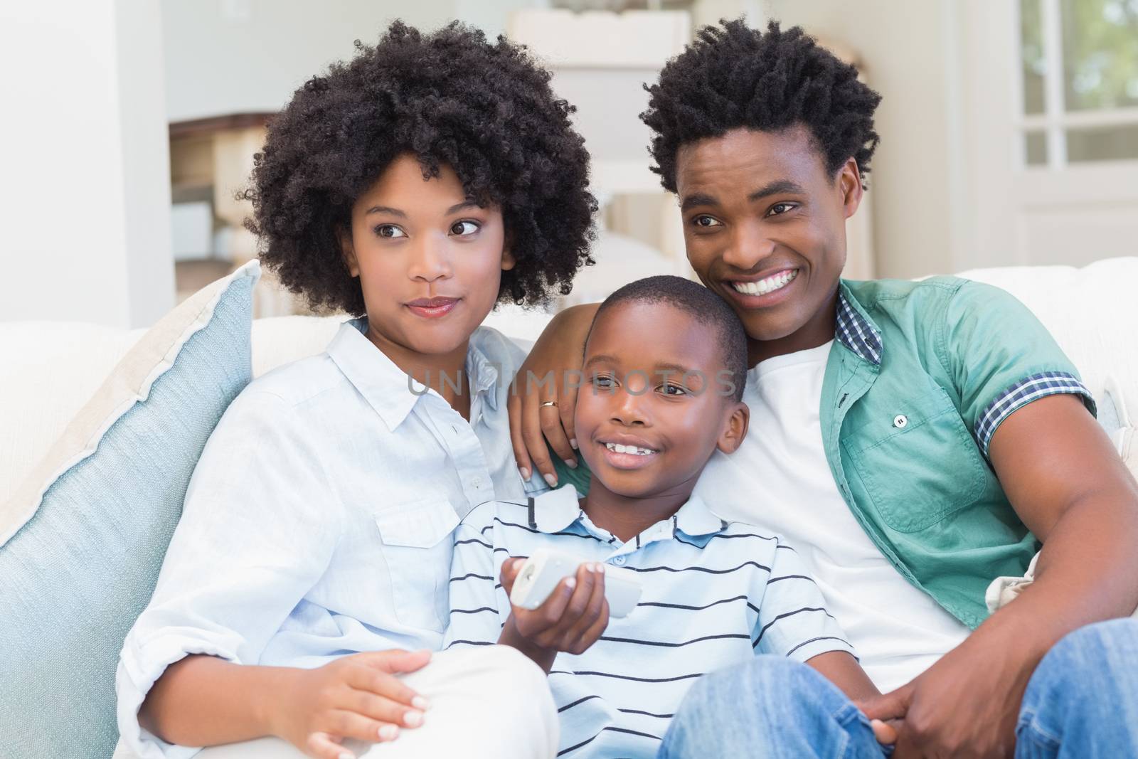 Happy family on the couch at home in the living room