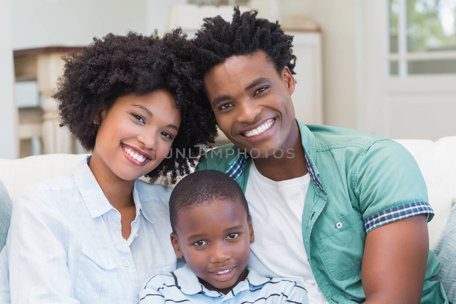 Happy family on the couch at home in the living room