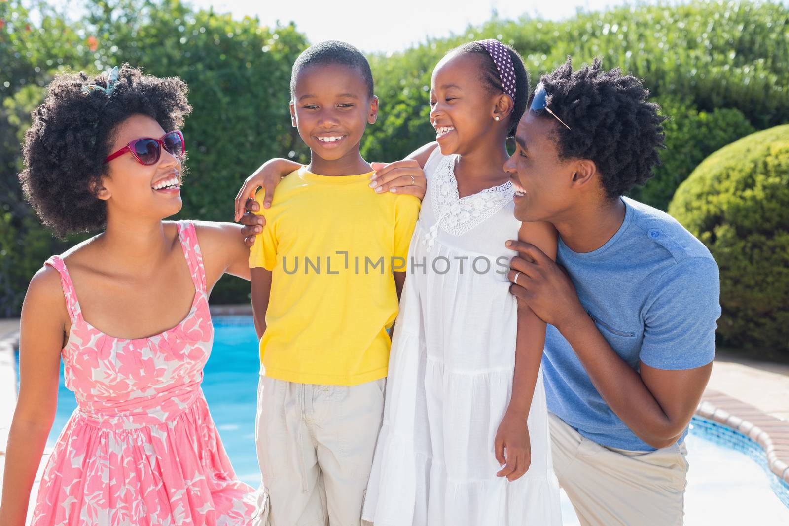 Happy family smiling at each other in the garden at home