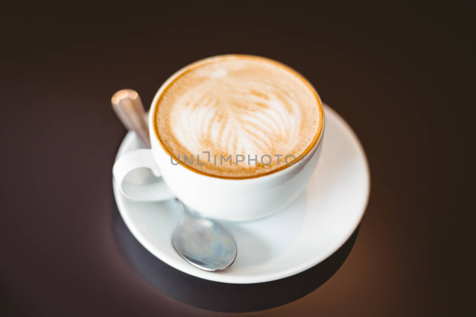 Cup of coffee on table  by Wavebreakmedia