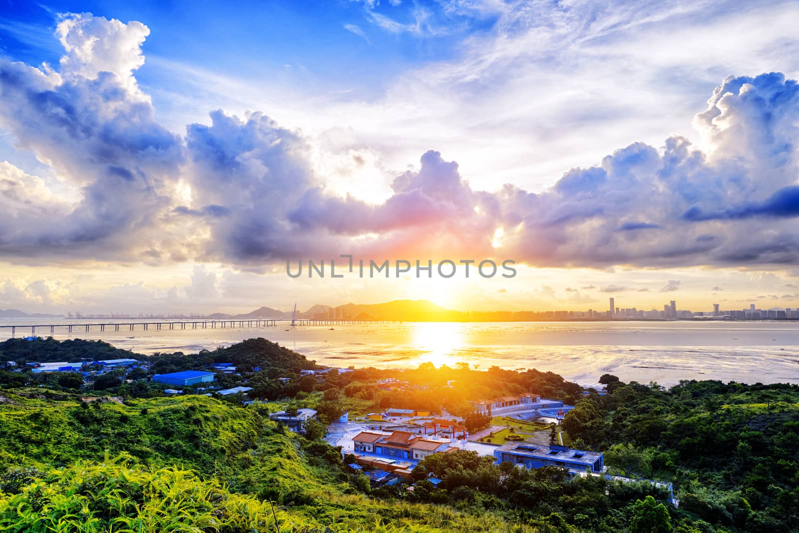 Village with beautiful sunset over hong kong  coastline. View from the top of mountain