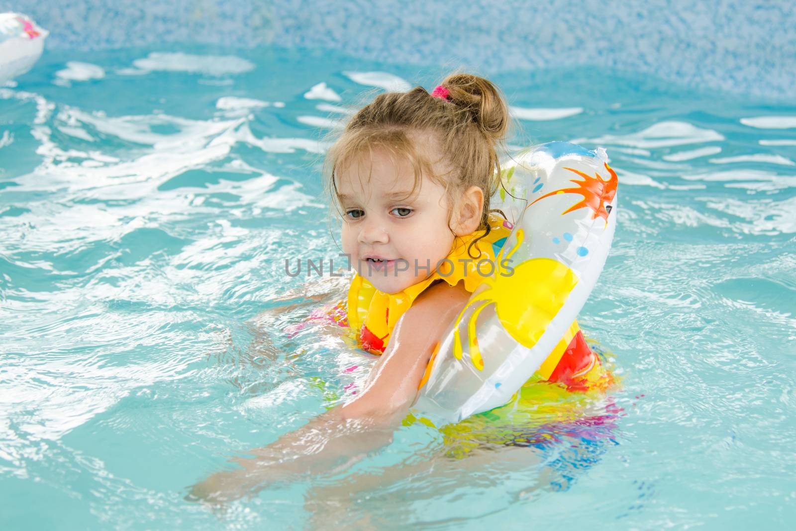 Six year old girl Europeans bathed in a small suburban pool