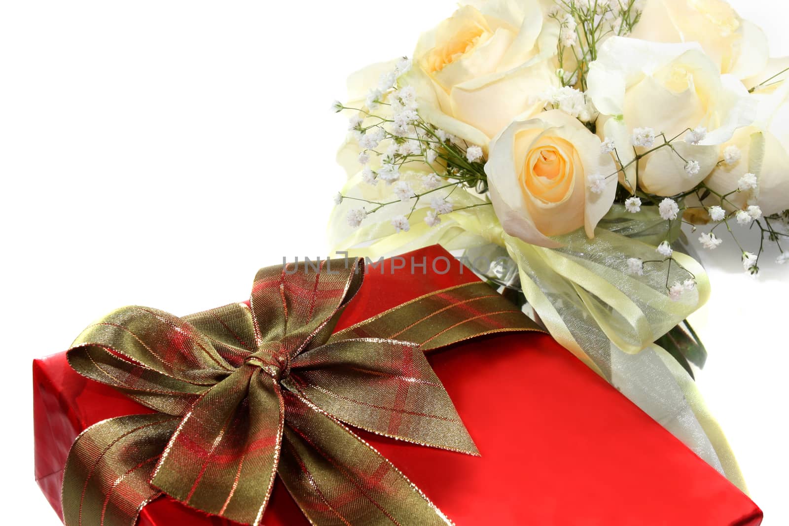 Red gift box and white roses