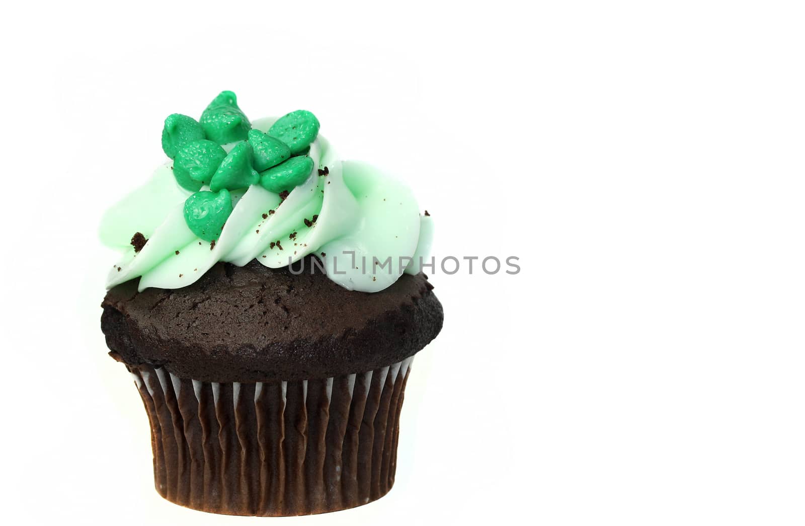 Green cupcake on white background
