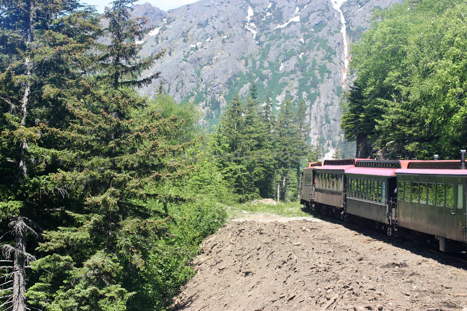 Old train traveling through mountains