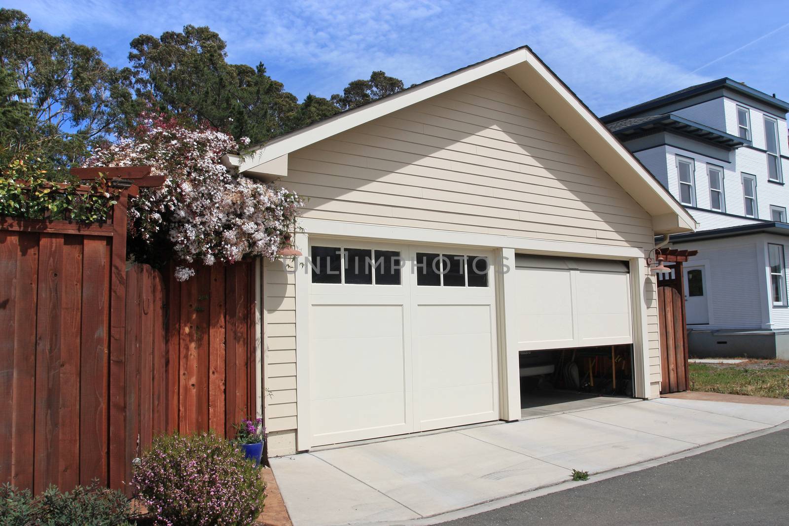 Open garage door in suburban house 