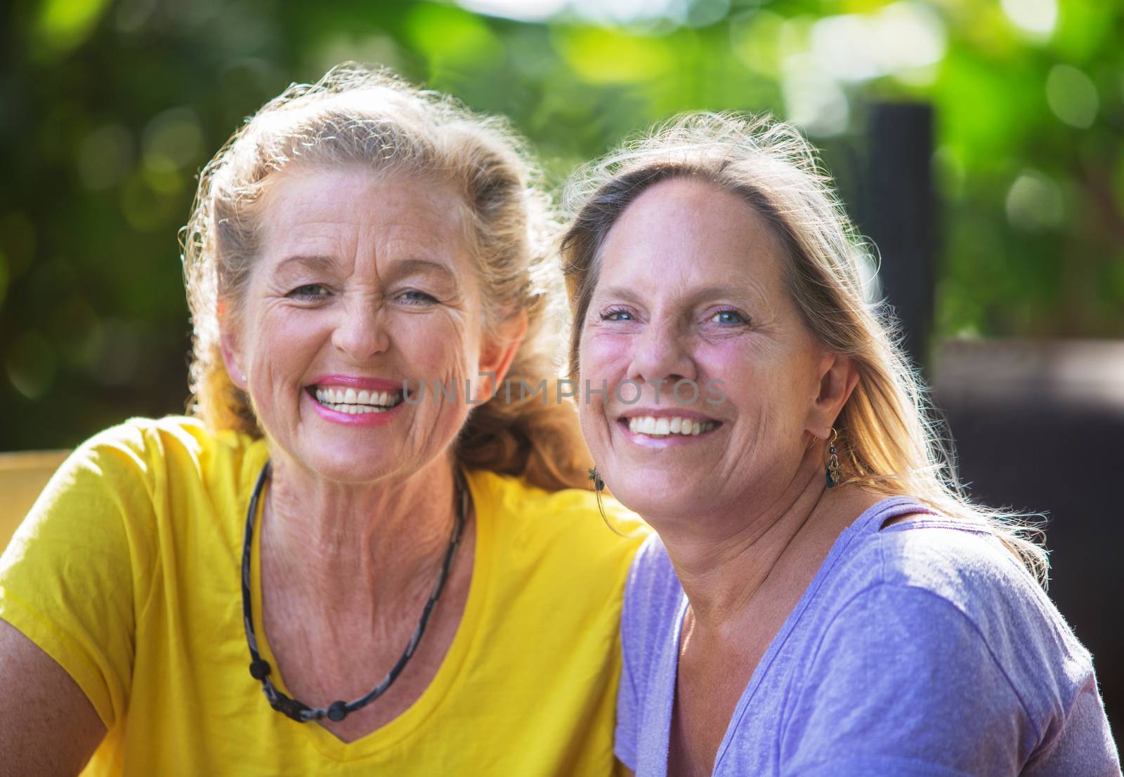 Close up of smiling mature Caucasian female friends