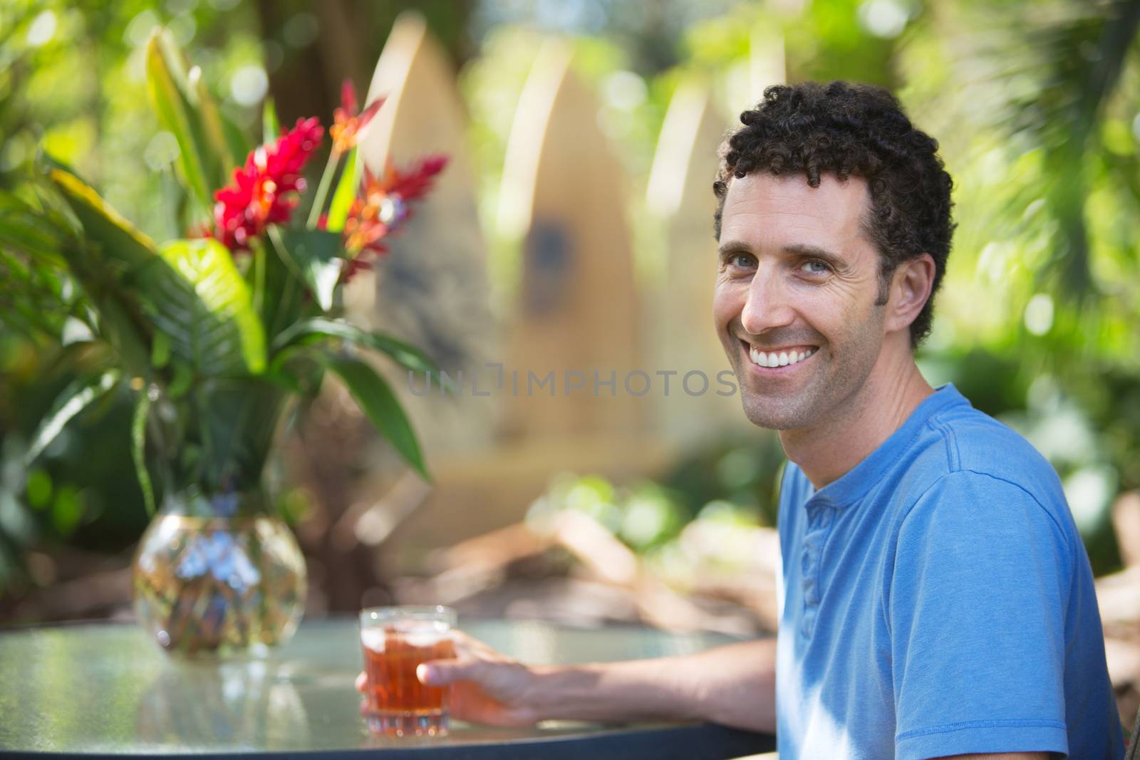 Happy Man in Maui with Drink by Creatista