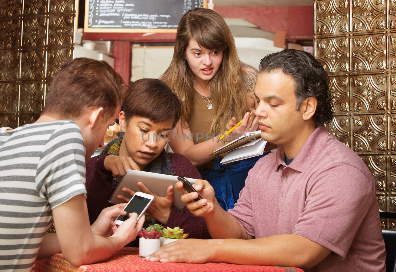 Annoyed cafe hostess annoyed with distracted customers