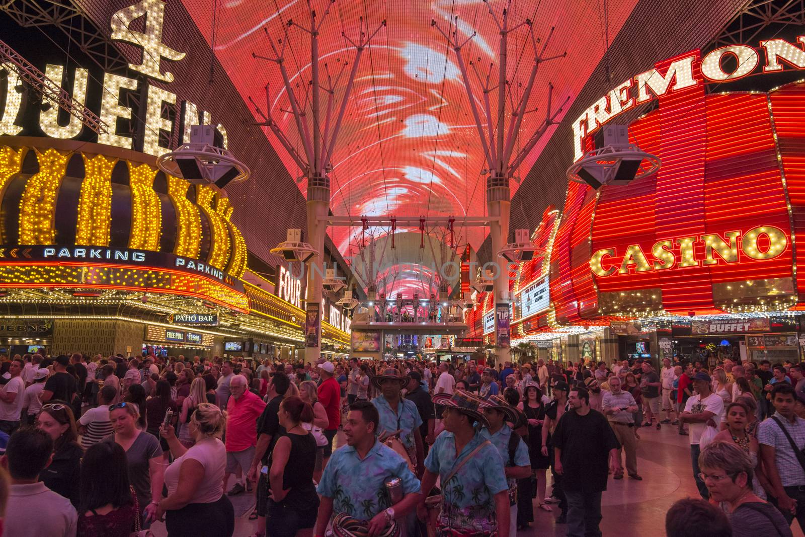 LAS VEGAS, USA - MAY 28, 2015: Huge crowds of tourists gather under the world's largest video screen to enjoy live entertainment, beer, food and casinos at the Fremont Street Experience in Las Vegas