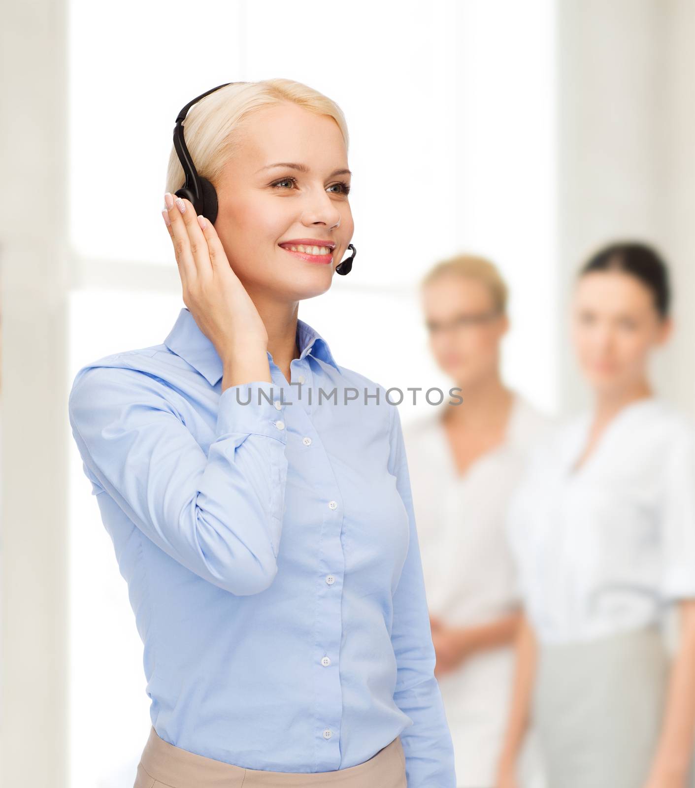 business, technology and call center concept - friendly female helpline operator with headphones