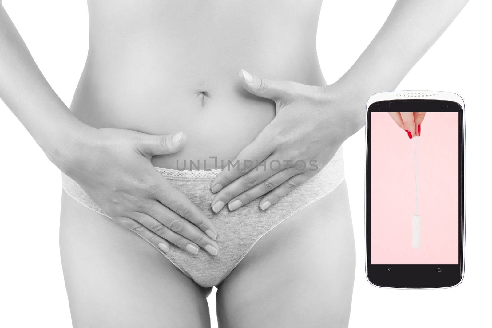 Beautiful woman touching her belly and mobile phone with ovulation cycle app. Menstruation, period, pregnancy in the information age. Feminine body.