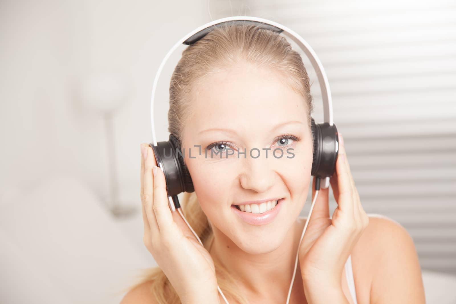 Young woman listening to music by ifilms