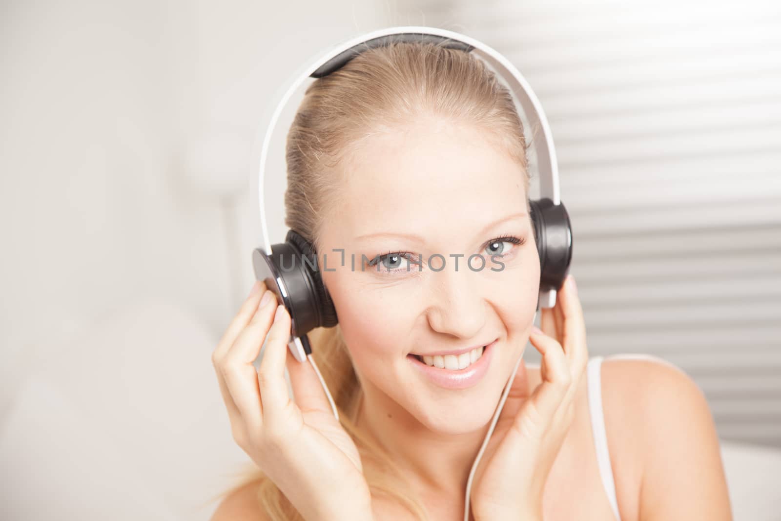 Young woman listening to music by ifilms