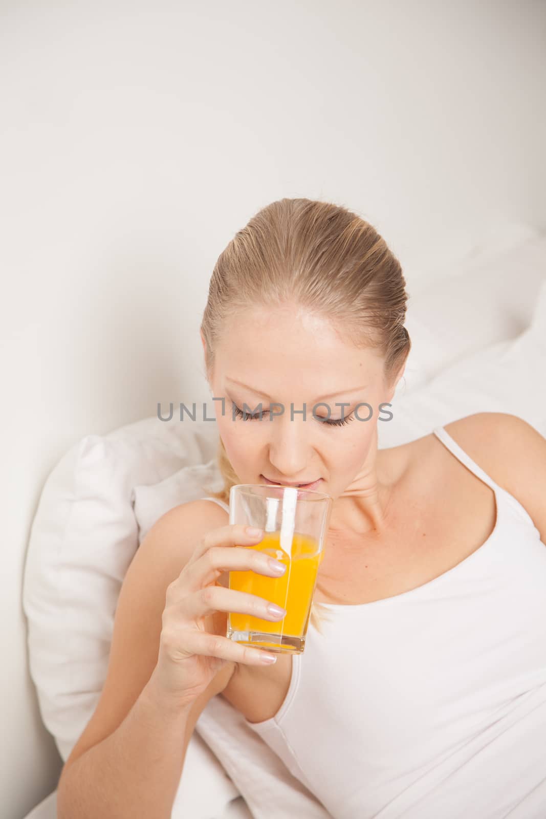 Young woman drinking a juice