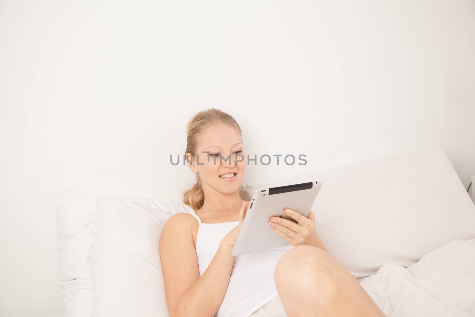 Woman using the tablet by ifilms