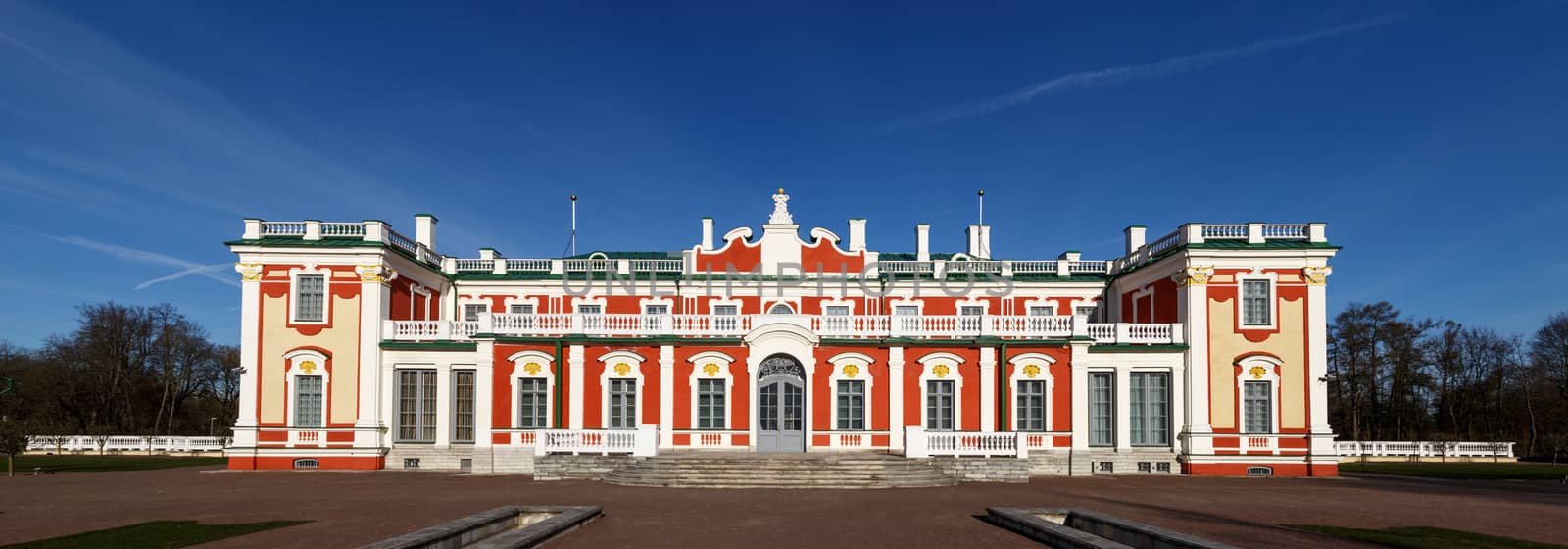 Front view of Kadriorg Palace in Tallinn Estonia, built by Tsar Peter the Great in 1725, on navy blue sky background.