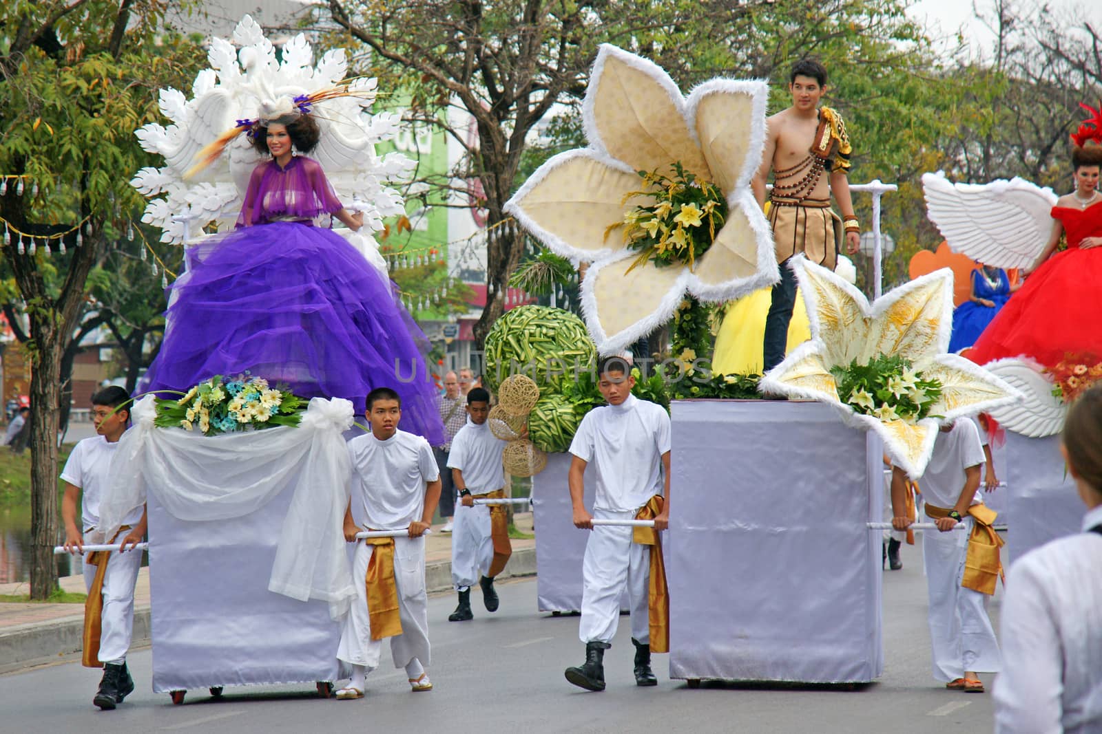 Thai people on the parade in ChiangMai Flower Festival 2013 by mranucha