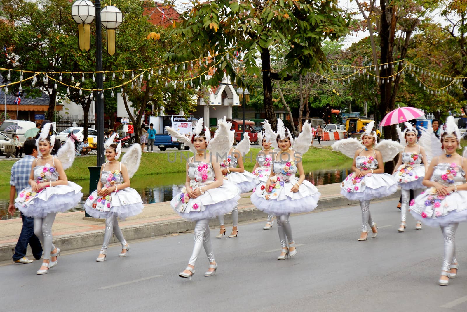 Thai people on the parade in ChiangMai Flower Festival 2013 by mranucha