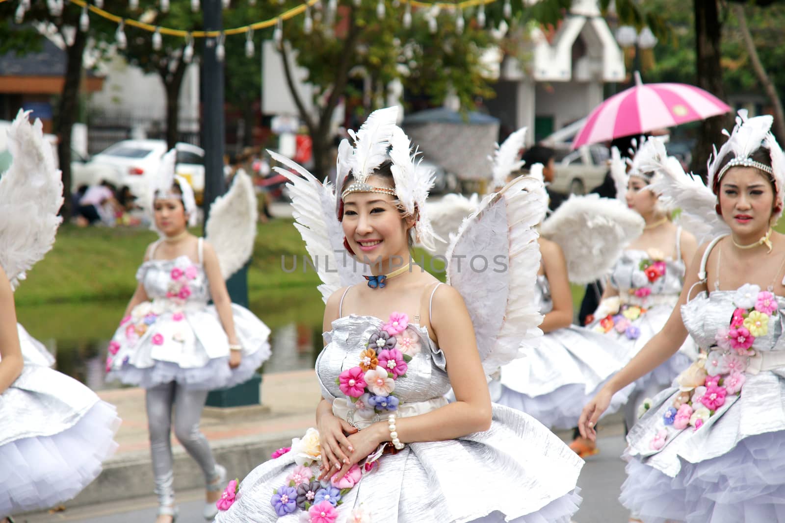 Thai people on the parade in ChiangMai Flower Festival 2013 by mranucha