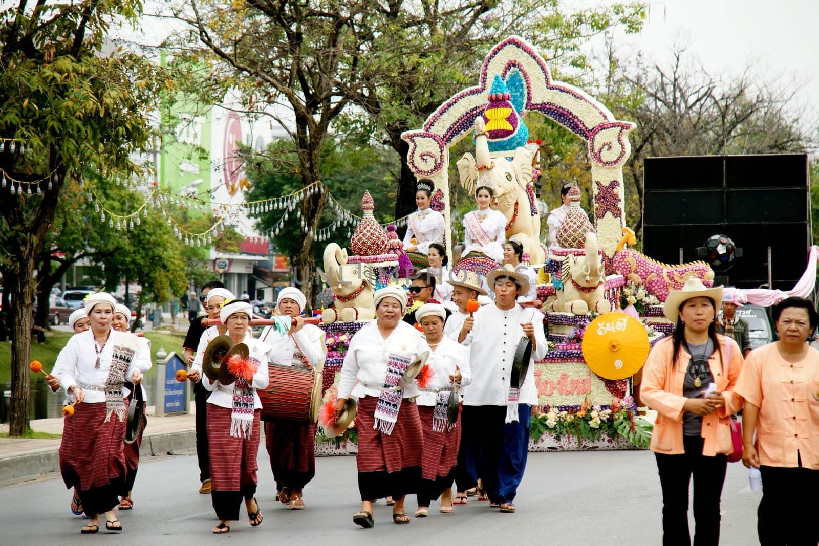 Thai people on the parade in ChiangMai Flower Festival 2013 by mranucha