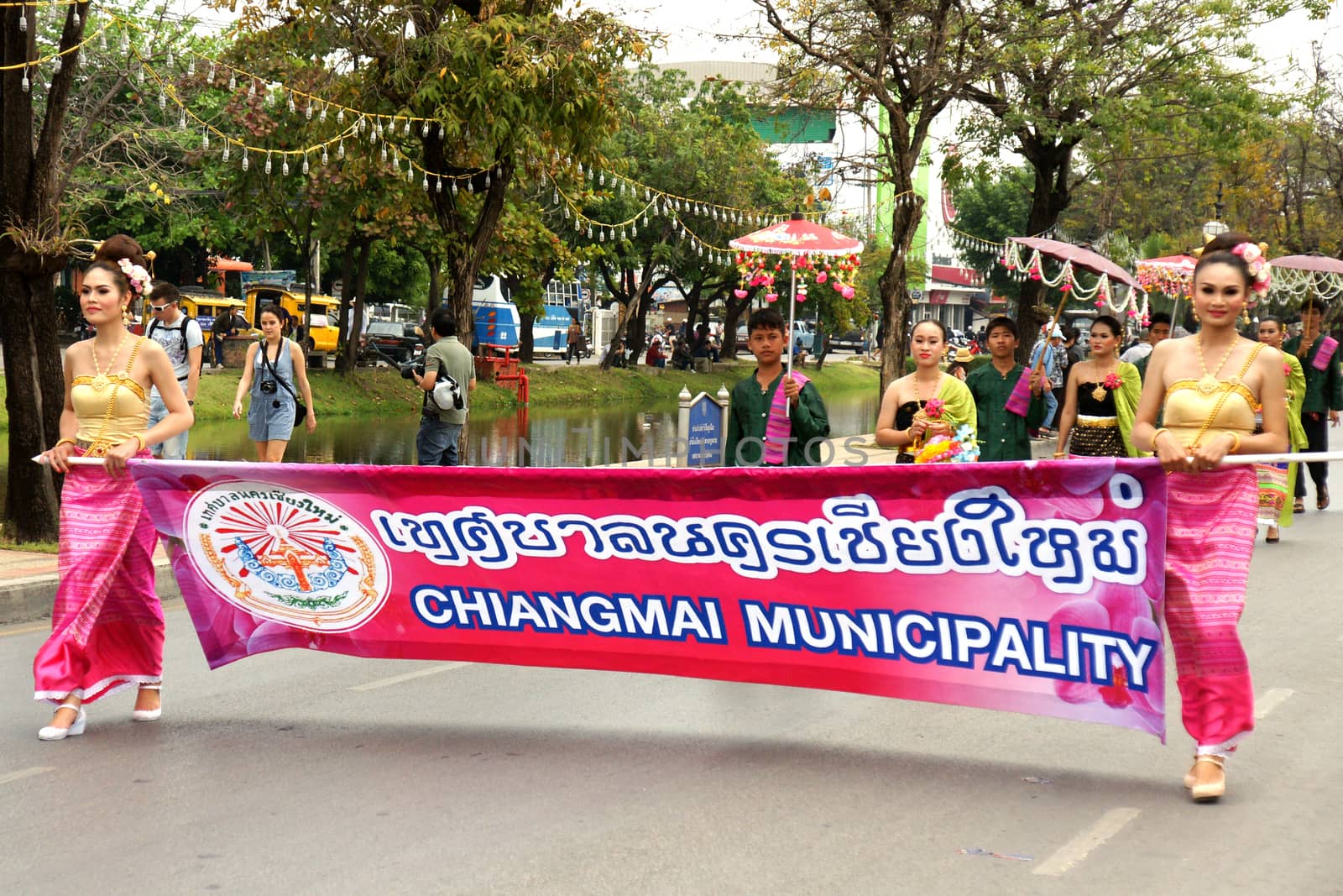 Thai people on the parade in ChiangMai Flower Festival 2013 by mranucha