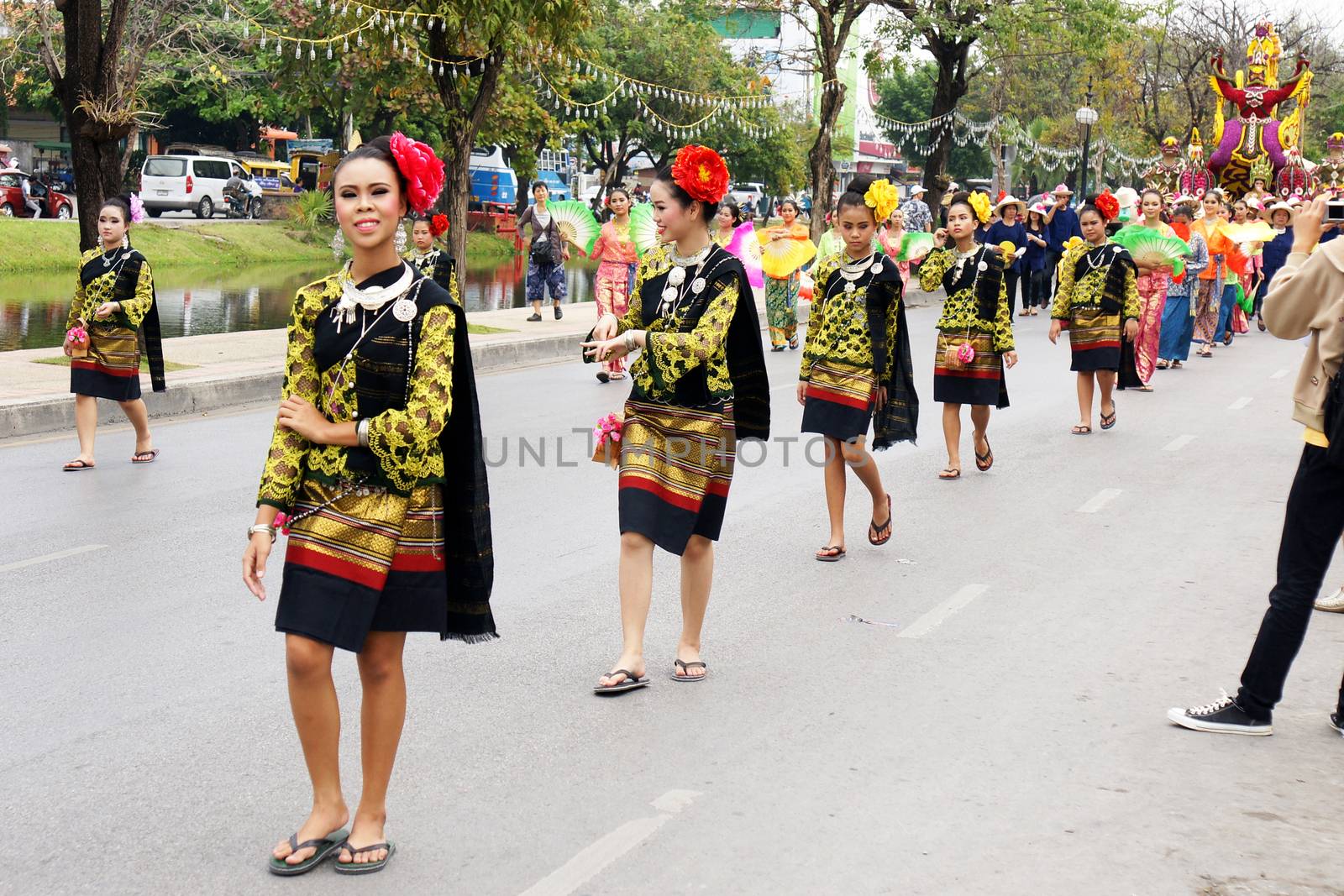 Thai people on the parade in ChiangMai Flower Festival 2013 by mranucha