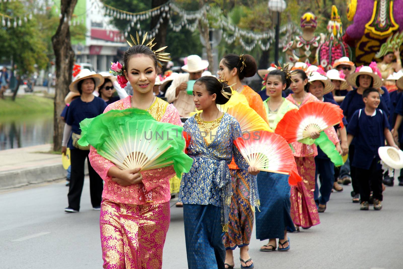 Thai people on the parade in ChiangMai Flower Festival 2013 by mranucha