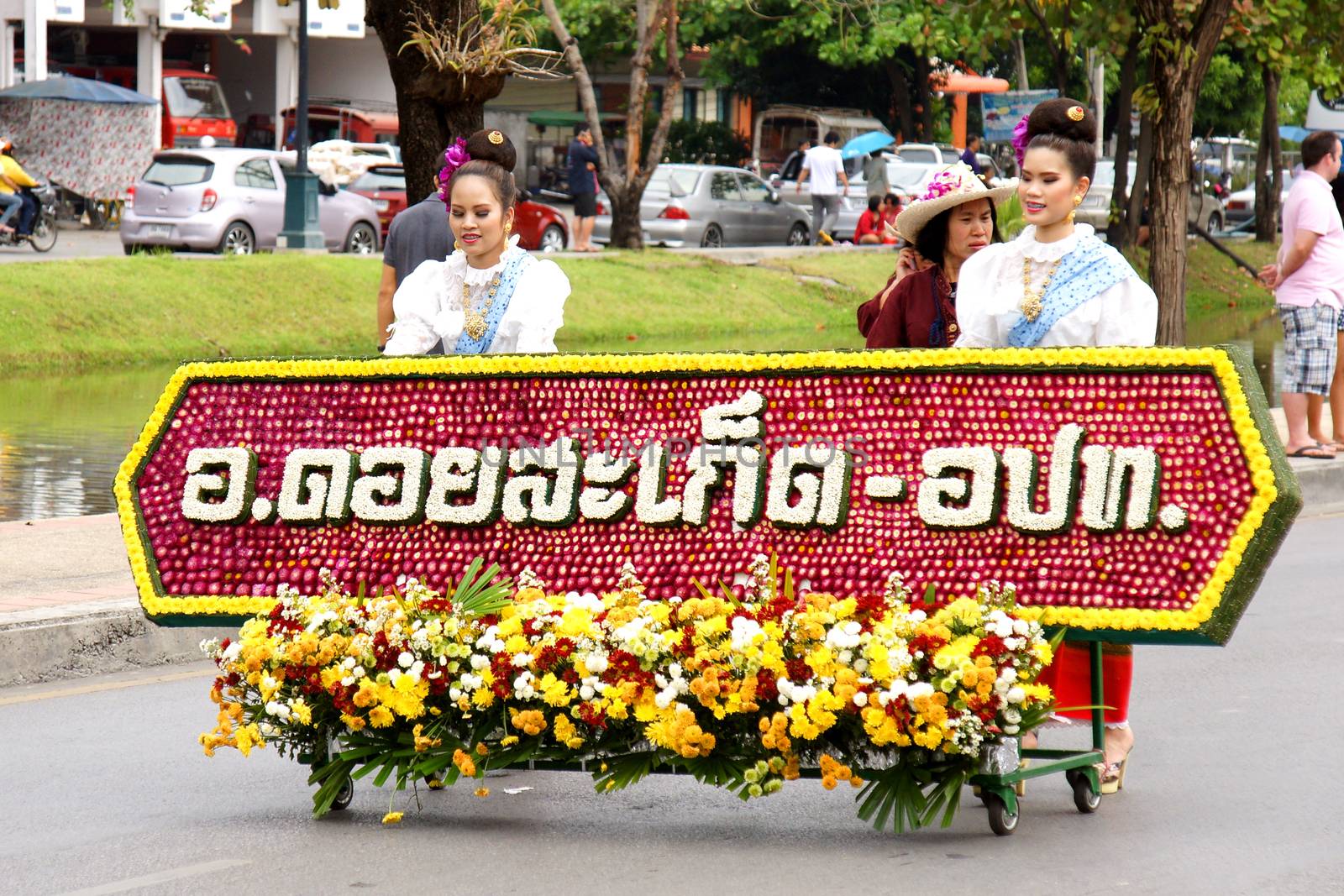 CHIANGMAI, THAILAND - FEBRUARY 2-2013 : Unidentified Thai people on the parade in ChiangMai Flower Festival 2013 at ChiangMai, Thailand.