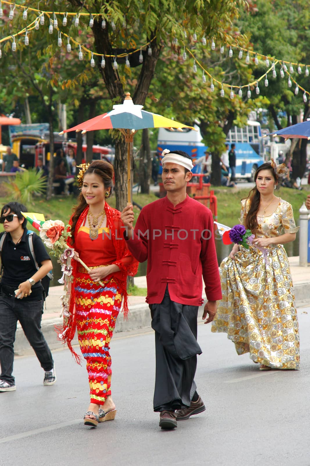 Thai people on the parade in ChiangMai Flower Festival 2013 by mranucha