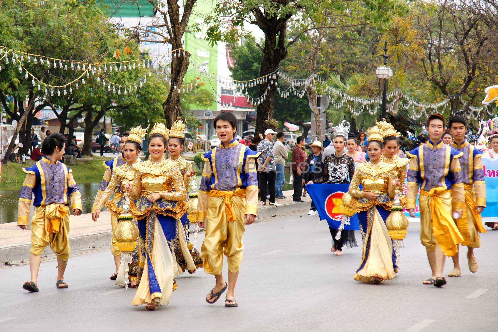 Thai people on the parade in ChiangMai Flower Festival 2013 by mranucha