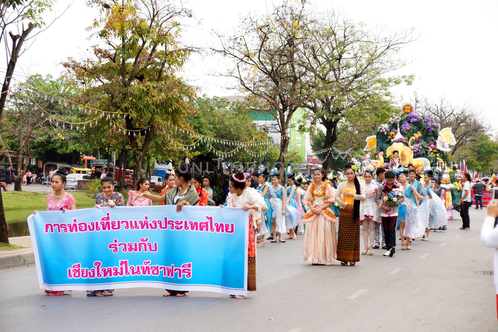 Thai people on the parade in ChiangMai Flower Festival 2013 by mranucha