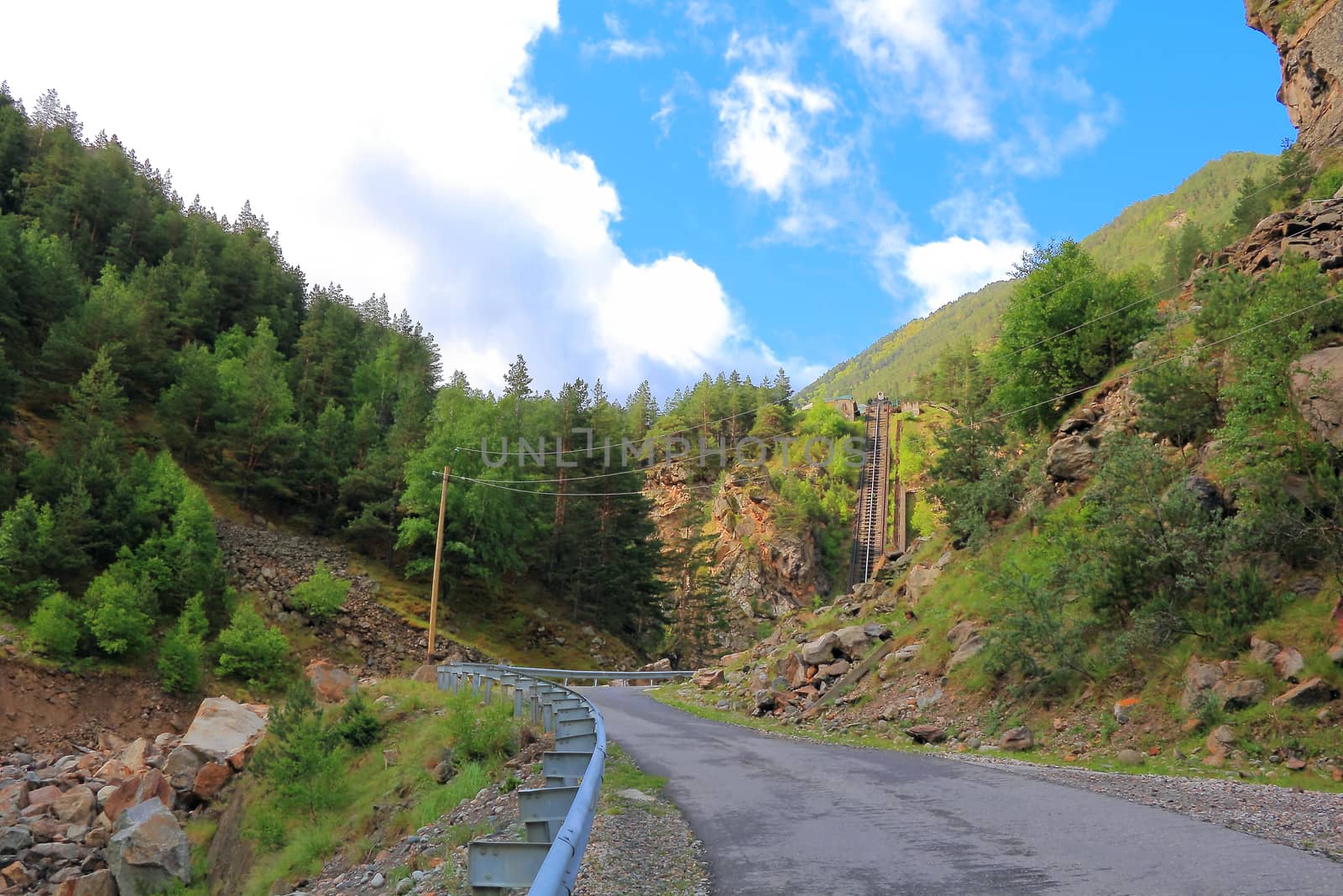 Landscape of road and lift in Caucasus green mountains