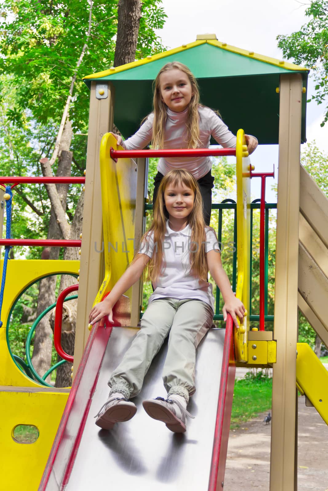 Photo of two active girls on nursery platform