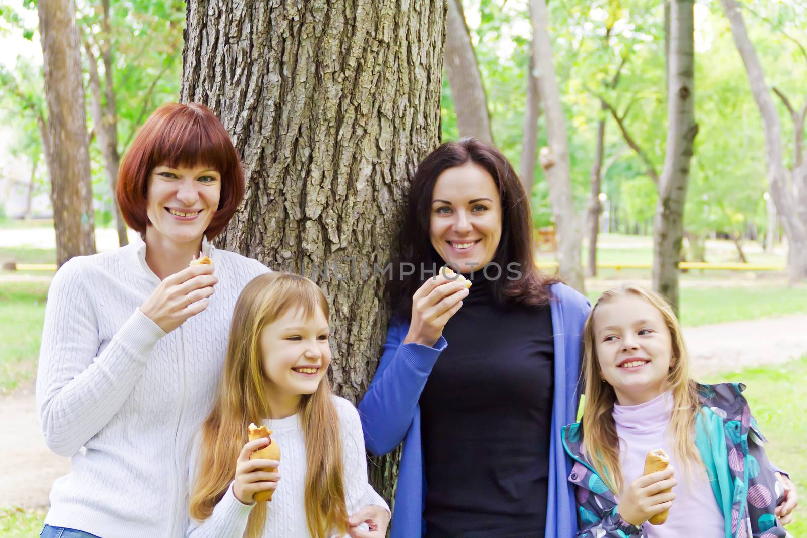 Photo of group laugh people are eating in summer