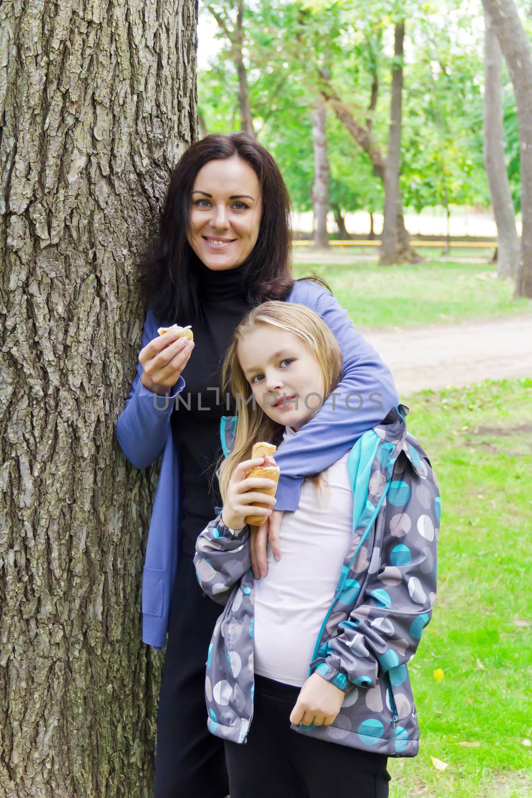 Photo of mother and daughter are eating