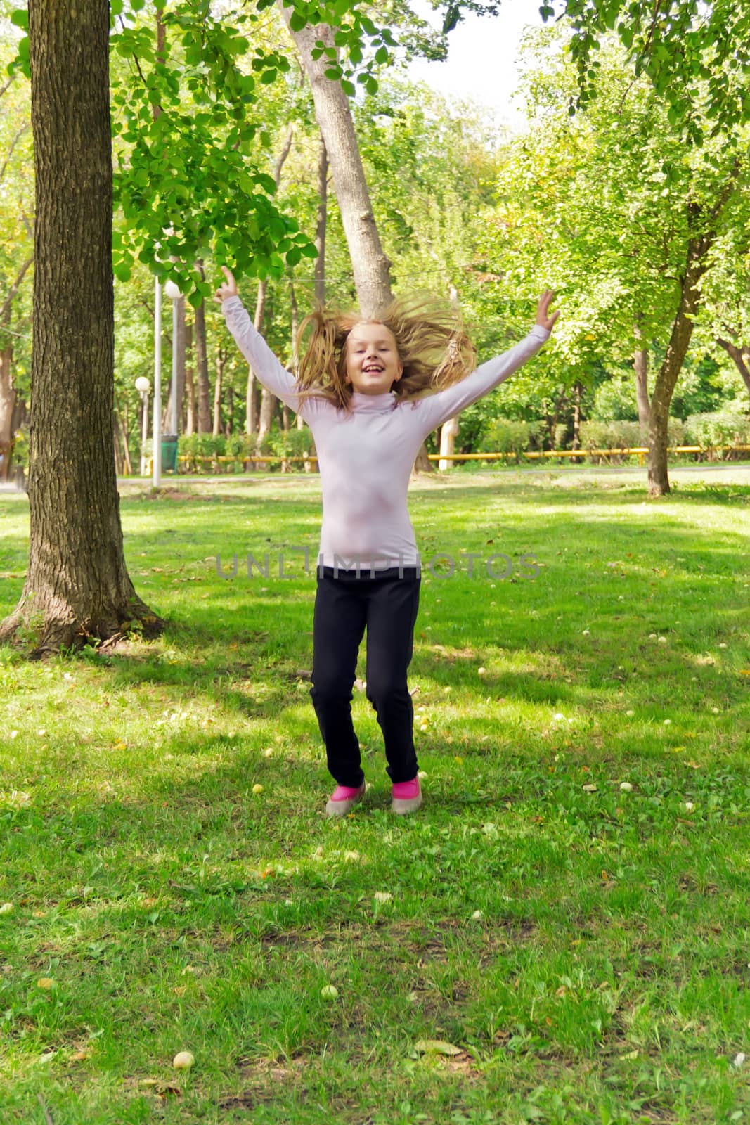 Photo of cute jumping girl in summer