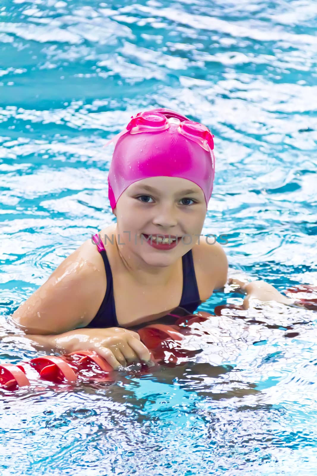 Photo of cute girl in swimming pool