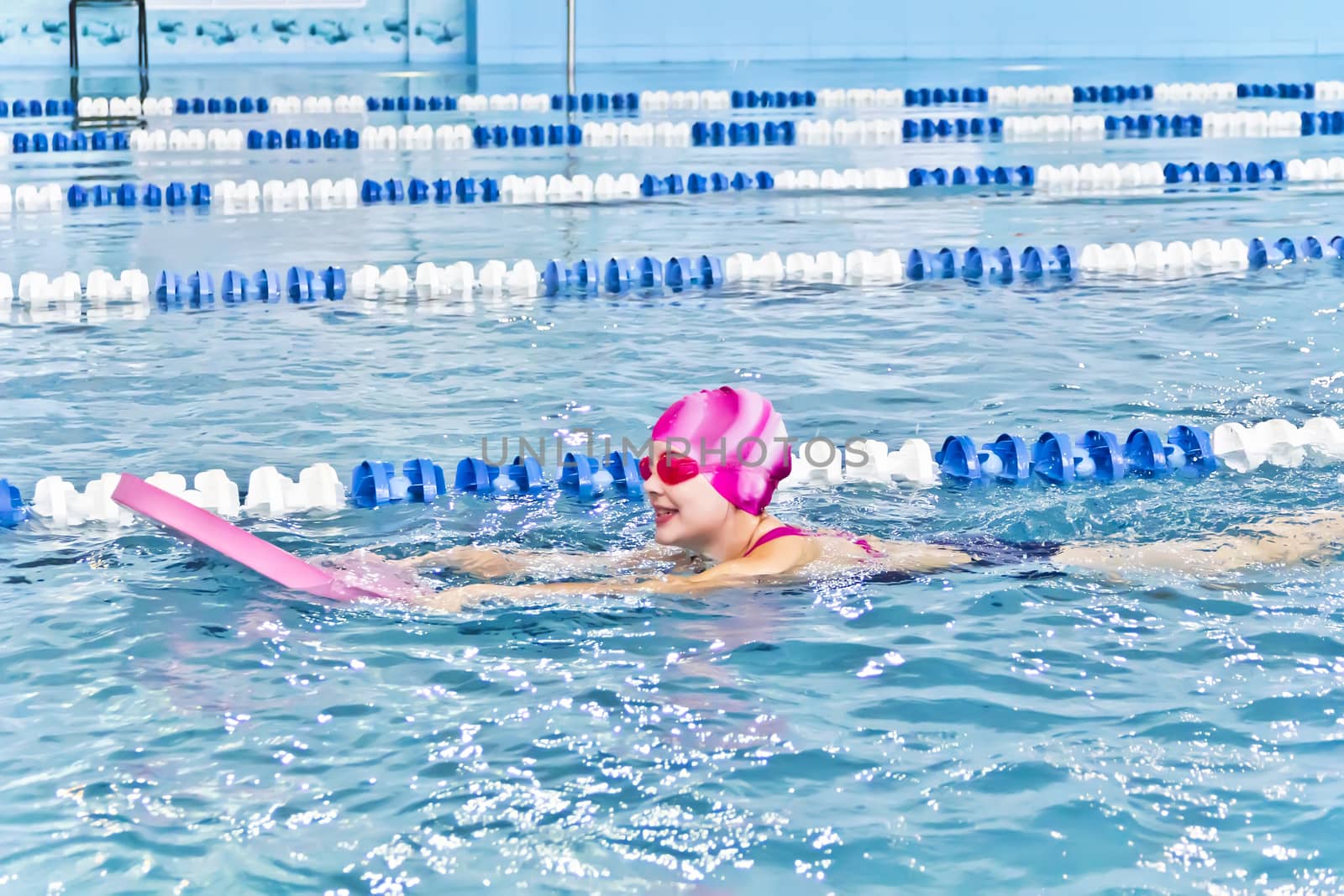 Photo of cute girl in swimming pool